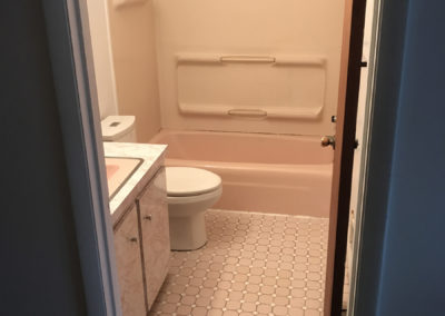 Outdated pink bath before remodel
